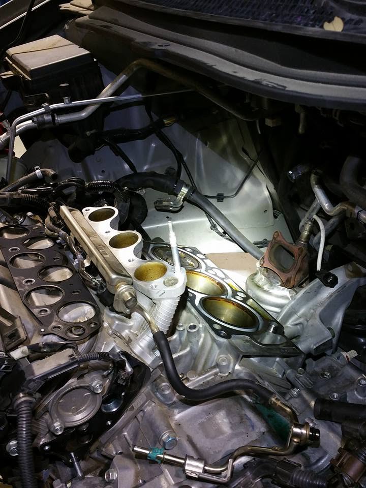 Engine bay with components removed for service