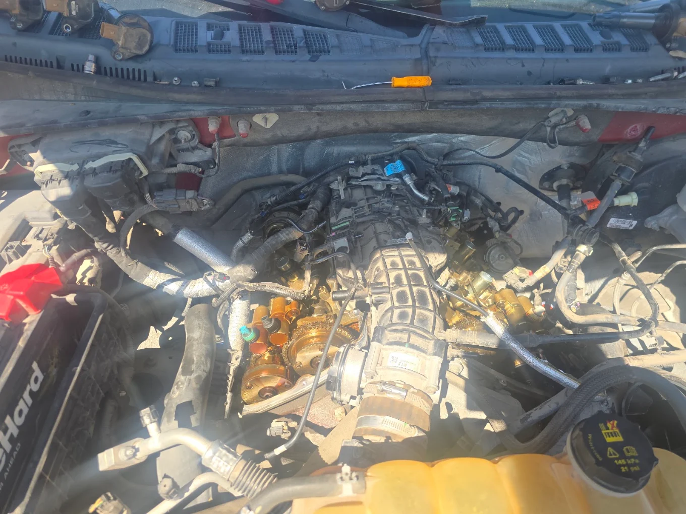 Open engine bay during a repair