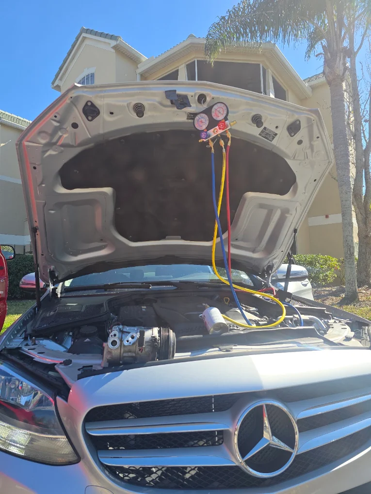 Mercedes vehicle with hood open for service