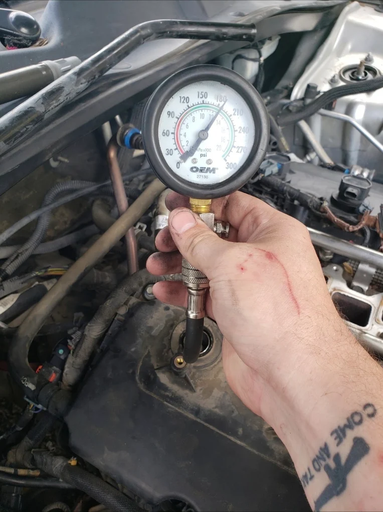 Pressure gauge being used during a vehicle test